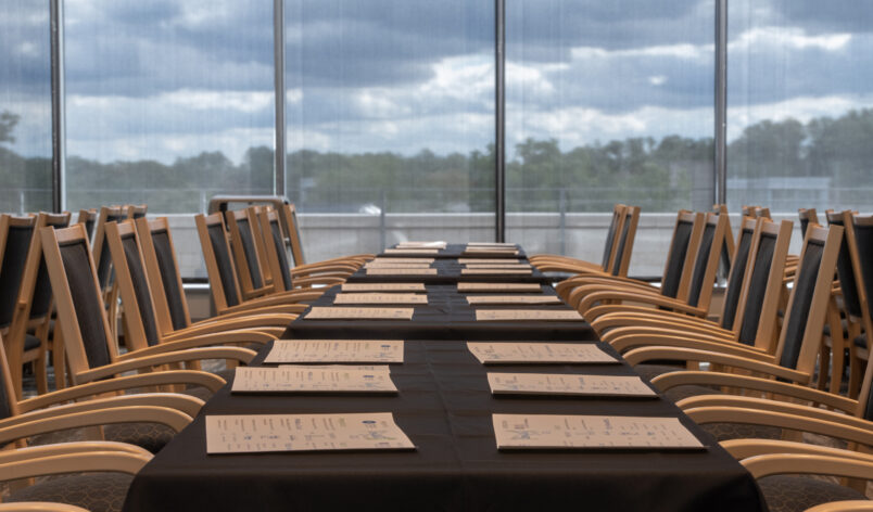 tables and chairs set up for the longest table event, an event that brings a diverse group of inter-generational guests to have meaningful conversations over a meal.