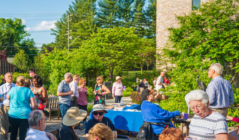 Overhead shot of the enchanted garden during a community event with information tables