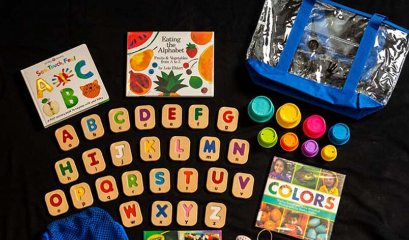 contents of Literacy Activity kits that include free access to engaging books and educational toys to help children play and learn developmental skills.