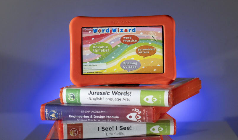 a stack of launchpads cases with a free tablet at the top.