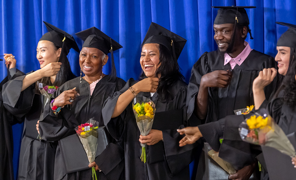 Graduates from Project Literacy with smiles.