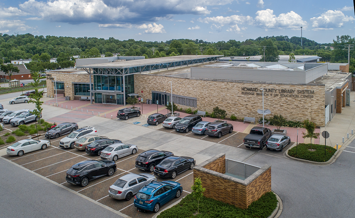 a large masonry library building with environmental pavement.