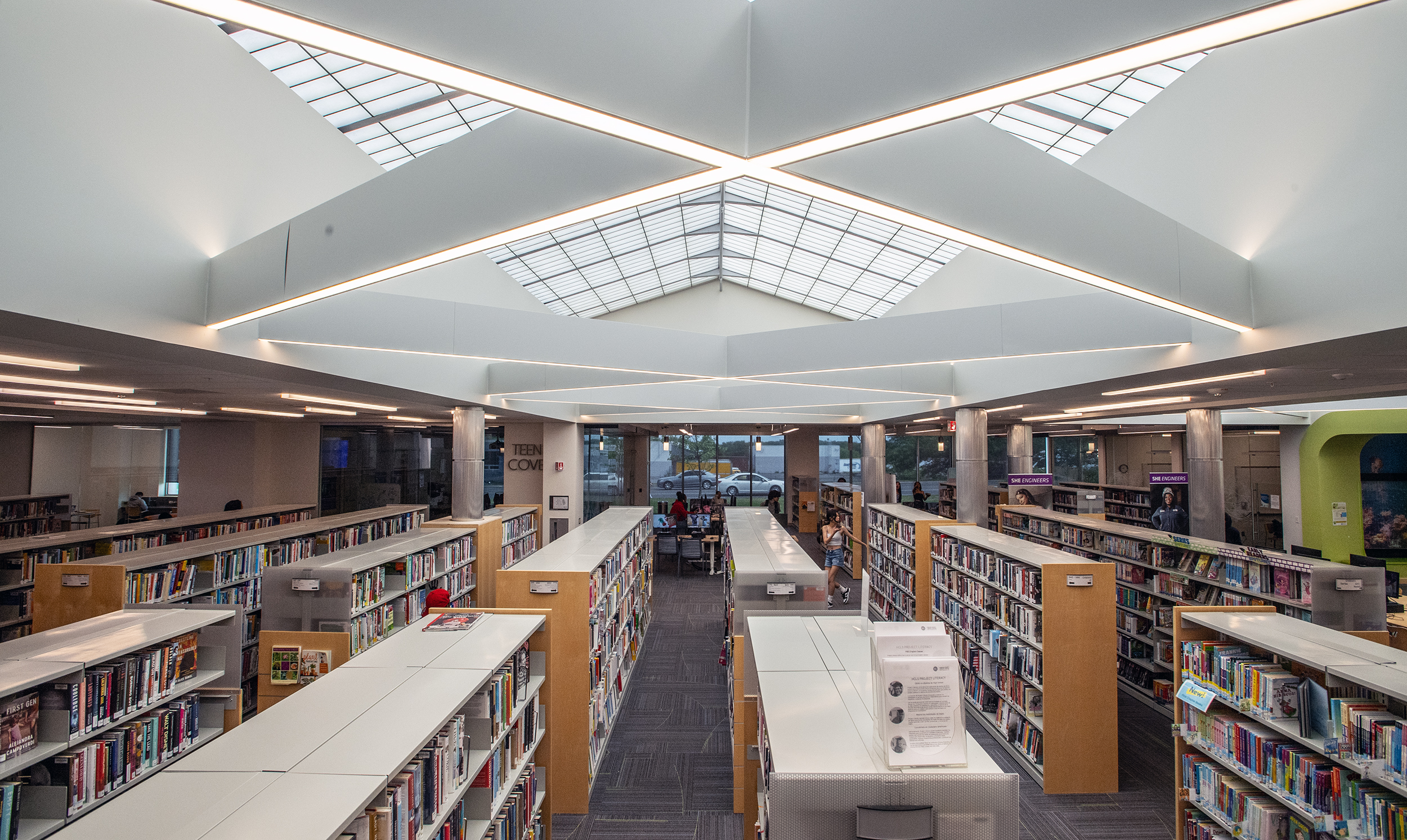 Stacks with books, movies, music, and magazines and newspapers Elkridge Branch of the Howard County Library System.