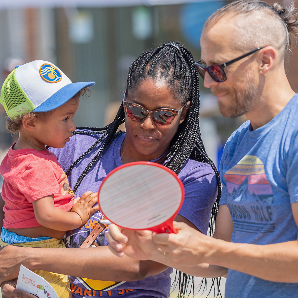Parents celebrating summer at the library.
