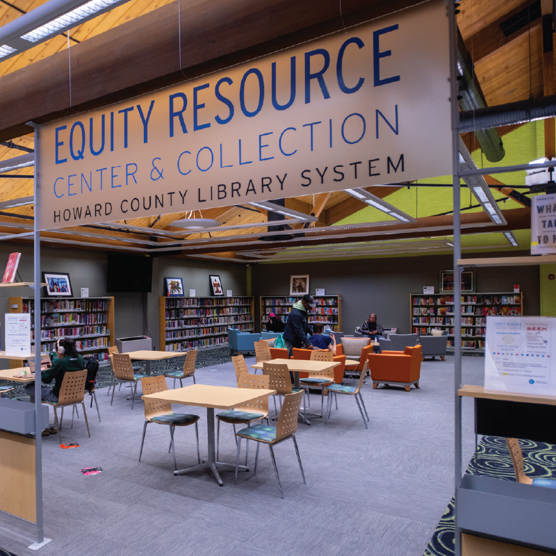 Interior of the Equity Resource Center & Collection at Howard County Library System, featuring open seating, bookshelves, and a welcoming space for learning and community connection.