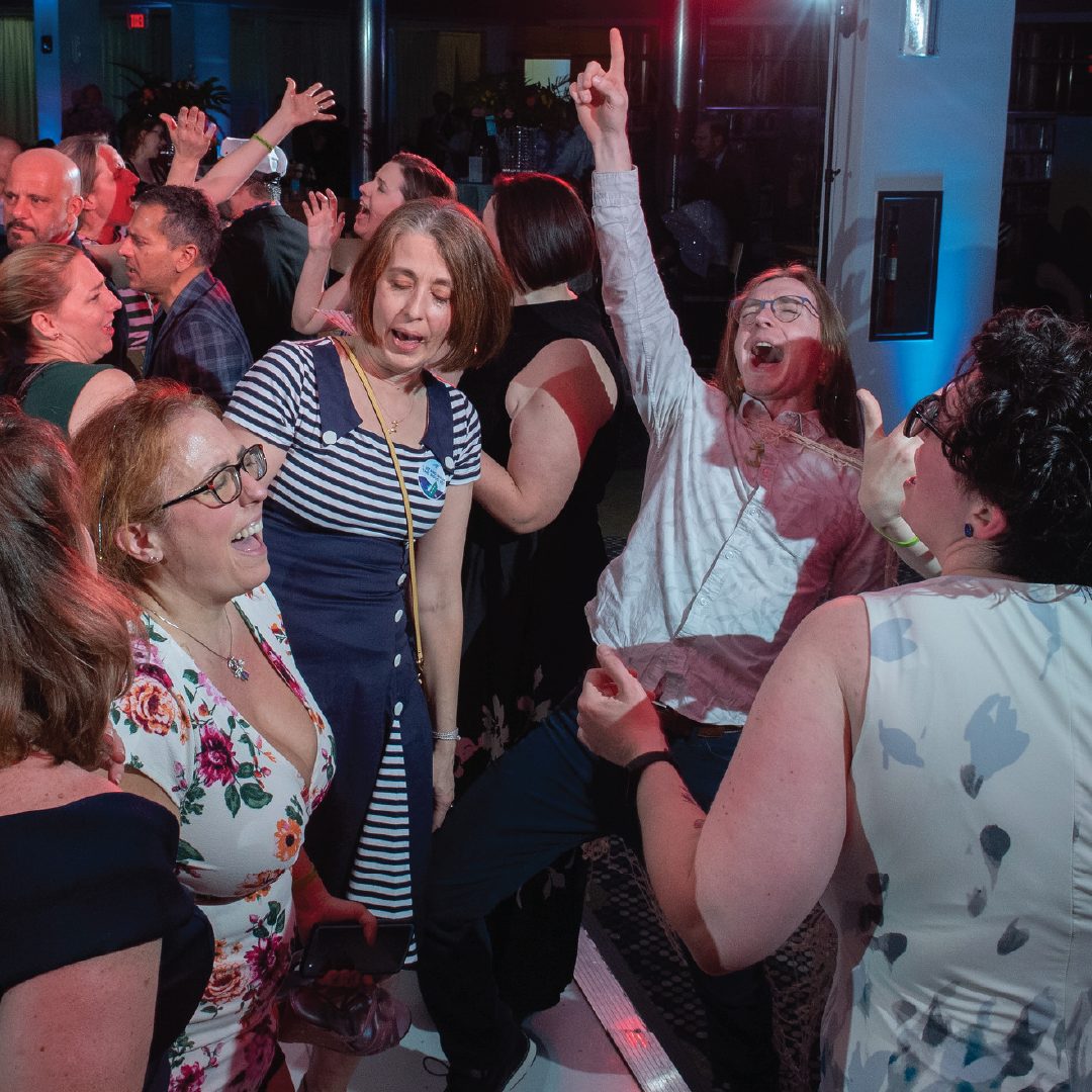 People dancing at the 2026 Evening in the Stacks gala.